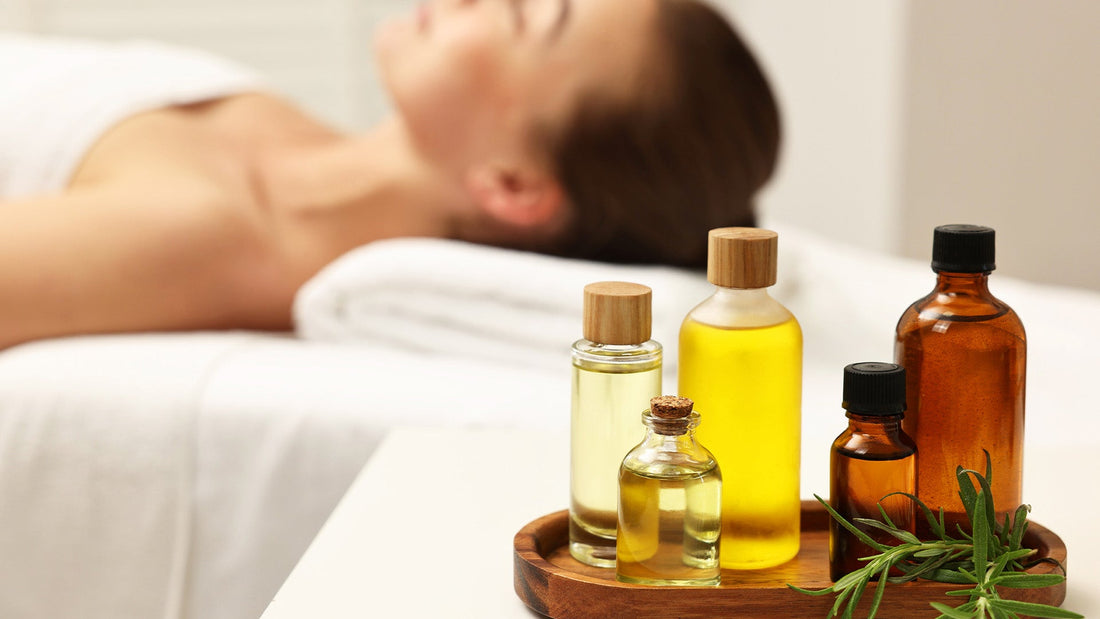 pyurvana essential oils in a tray near a woman sleeping in a spa bed