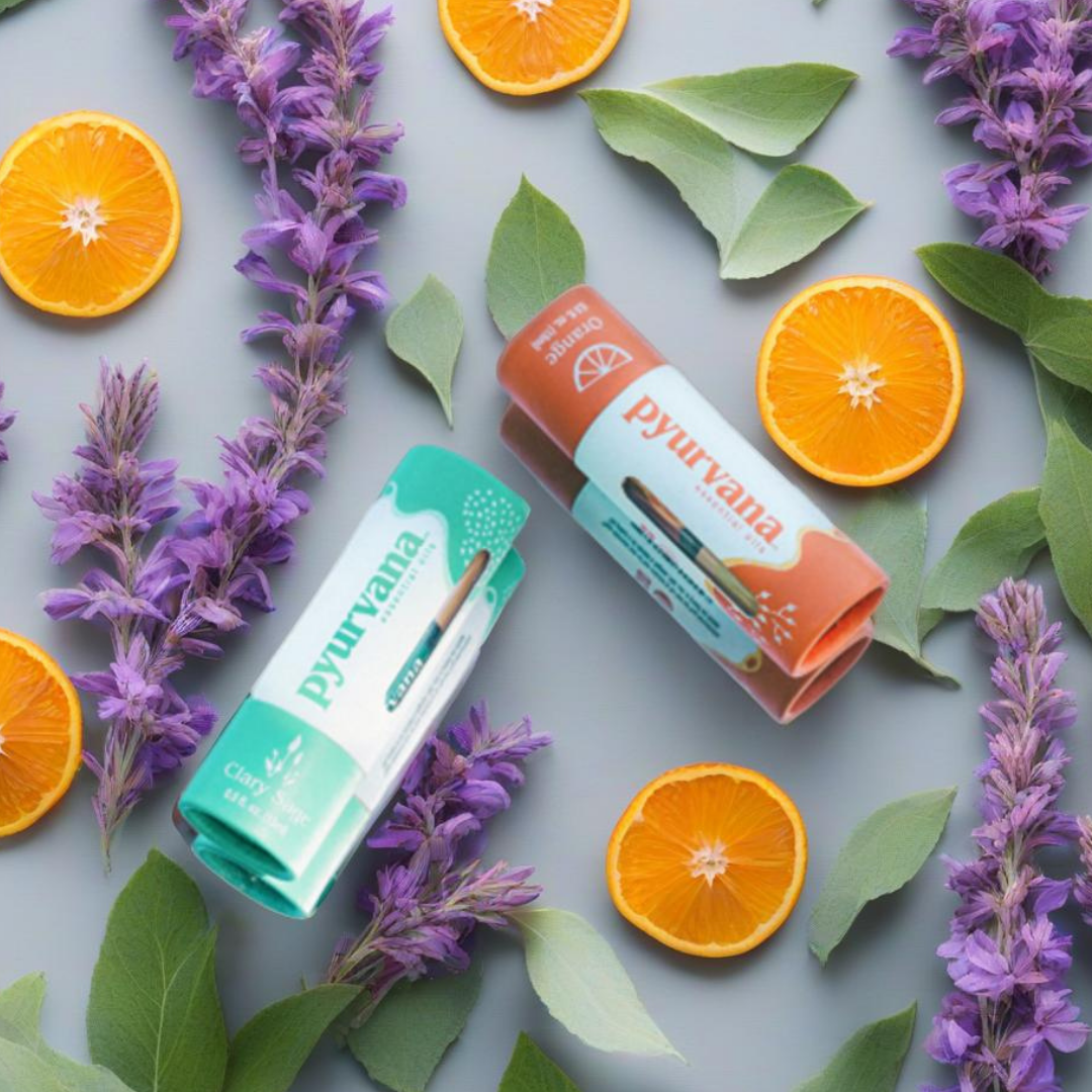 pyurvana essential oils on the gray surface with orange slices and lavender