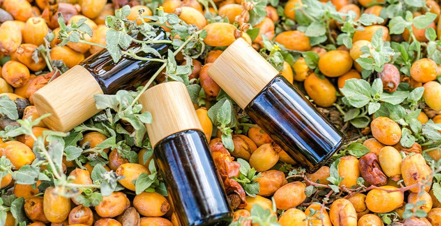 pyurvana essential oil bottles on herbal fruit