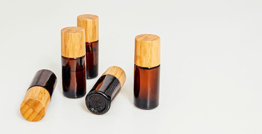 many pyurvana essential oil bottles on a white surface