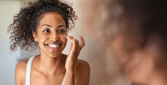 a girl applying pyurvana essential on her face