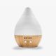 a bottle of ceramic ultrasonic essential oil diffuser with a bamboo base on a white background